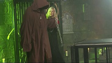 A mysterious friar fucks his slave in front of the other one caught in the cage